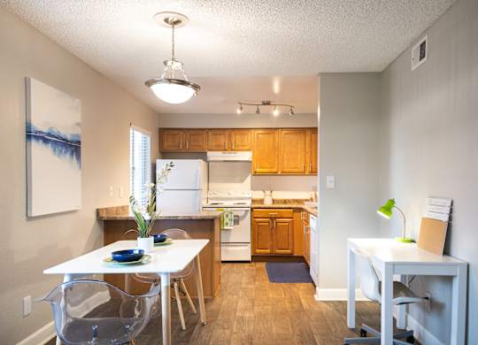 an open kitchen and dining room with a white table and chairs at Granite Bay, Phoenix, Arizona, 85023