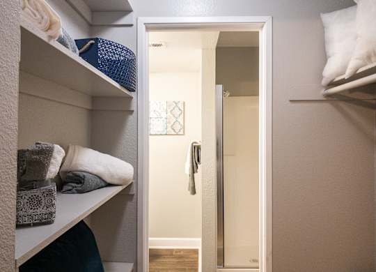 a closet with shelves and a mirror and a door to a bathroom at Granite Bay, Phoenix, Arizona, 85023