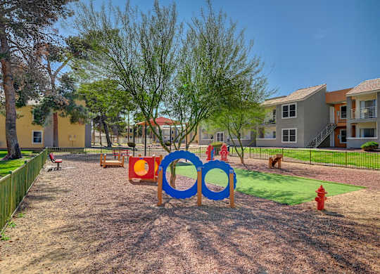 A playground with a blue and red sign that says