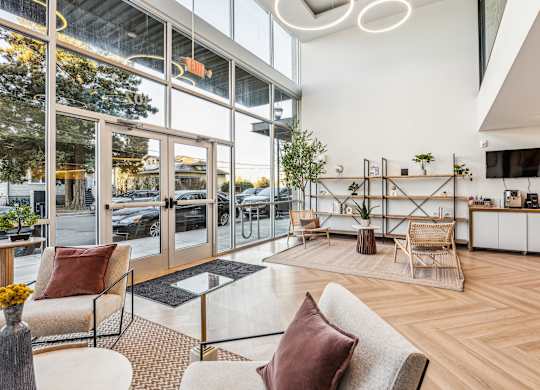 A modern living room with a glass door entrance.