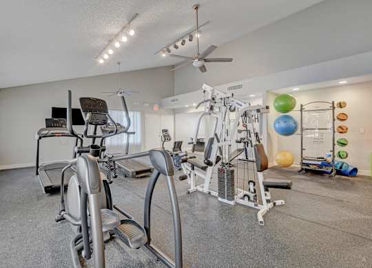 A home gym with a variety of exercise equipment.