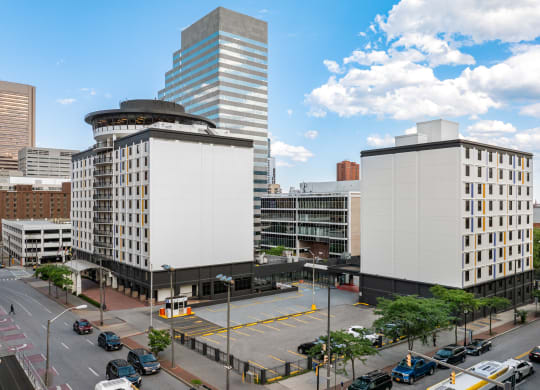 an aerial view of a city with two tall buildings and a parking lot at Vision on Lombard, Baltimore, MD 21201