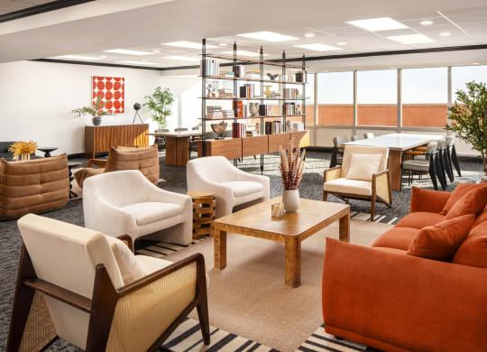 a living room filled with furniture and a table with chairs at Vision on Lombard, Baltimore, MD 21201