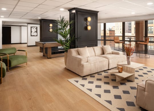 a living room with a couch and a table at Vision on Lombard, Baltimore, MD 21201