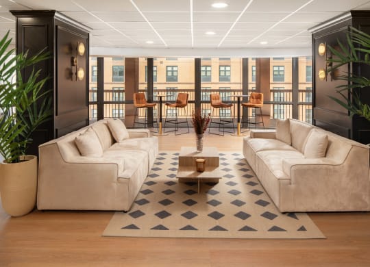 a living room with couches and a coffee table at Vision on Lombard, Baltimore, MD 21201