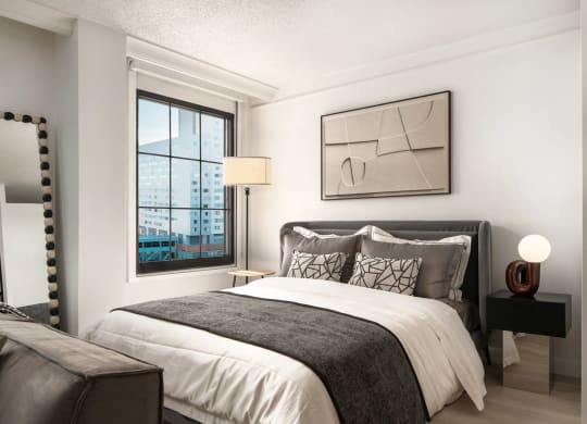 a bedroom with a bed and a window at Vision on Lombard, Baltimore, MD 21201