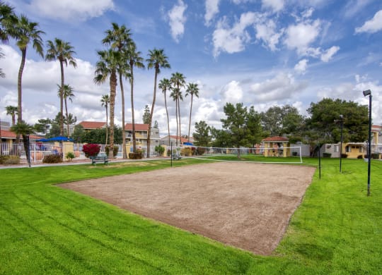 a baseball diamond with palm trees in the background at Valencia Park, Phoenix, Arizona