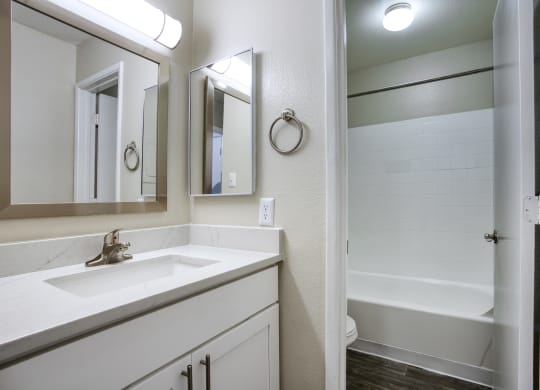 a bathroom with a sink and a bathtub at Valencia Park, Phoenix, AZ, 85008