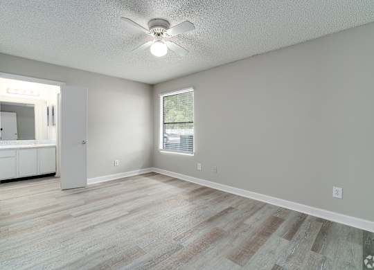 an empty living room with a ceiling fan and a window at Village Lakes, Orlando, FL, 32808