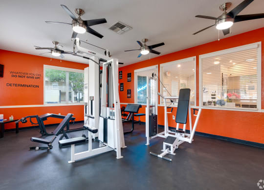 a gym with exercise equipment and ceiling fans at Village Lakes, Orlando, FL, 32808