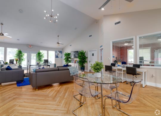 a living room with couches and a glass table and chairs at Village Lakes, Orlando, FL, 32808