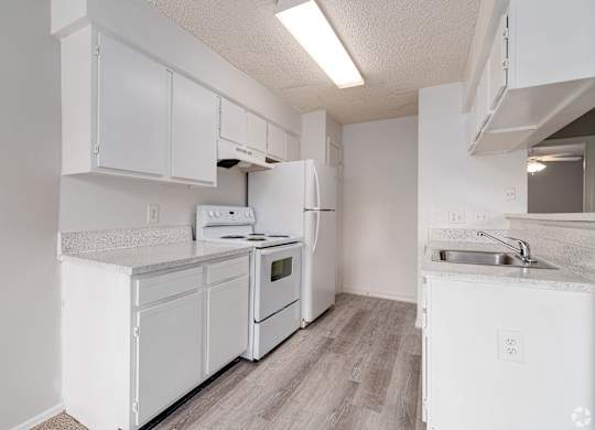 a white kitchen with white appliances and white cabinets at Village Lakes, Orlando, FL, 32808