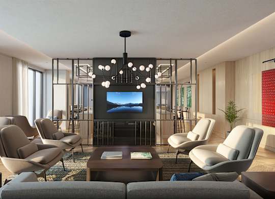 A modern living room with a large screen TV and comfortable seating.