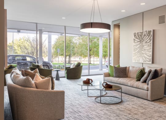 a living room with couches and chairs and a table