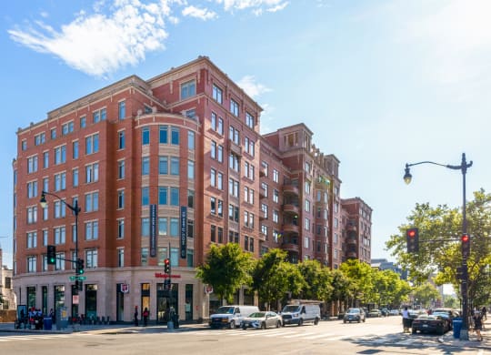 a large red brick building on a city street