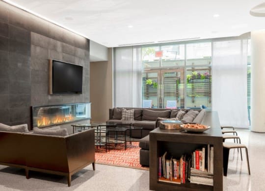 a large living room with a fireplace and a television
