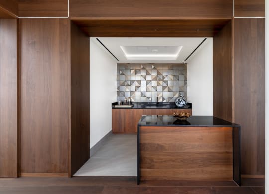 a hallway with wooden walls and a wooden reception desk at The Grace and Reva, Virginia, 22202