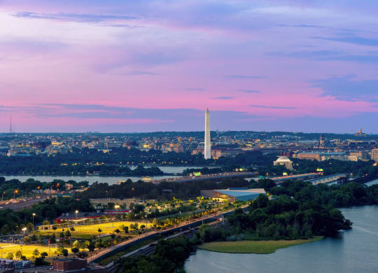 the monument and the potomac river at sunset at The Grace and Reva, Arlington, 22202