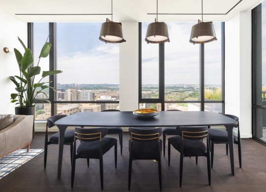 a dining room with a table and chairs in front of a window at The Grace and Reva, Virginia