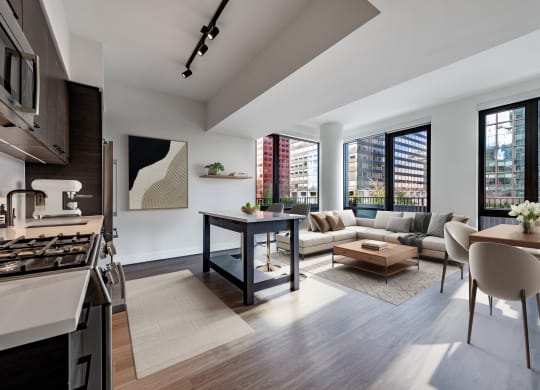 a living room with a kitchen and a couch and a table at The Grace and Reva, Arlington, Virginia