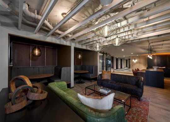 a lounge area with couches and chairs