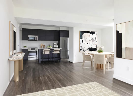 a living room and kitchen with a table and chairs at The Grace and Reva, Virginia, 22202