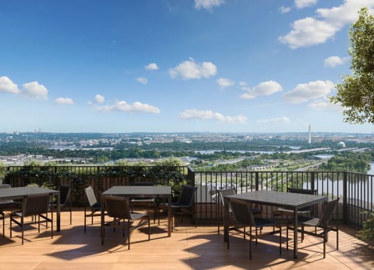 a restaurant or other place to eat on a balcony with a view of the city at The Grace and Reva, Virginia