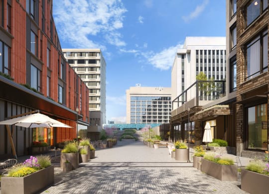 a rendering of a city street with tall buildings at The Grace and Reva, Virginia, 22202