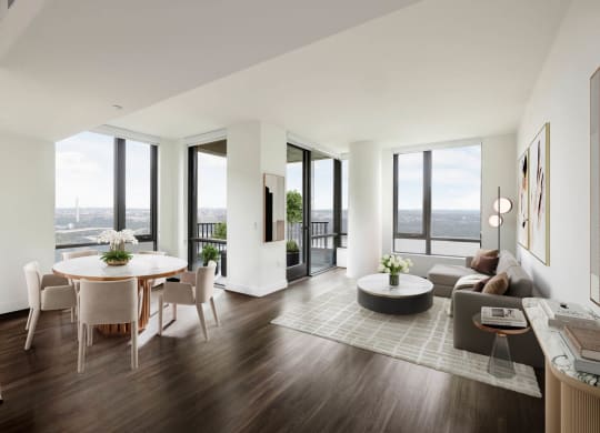 a living room and dining room in a building with floor to ceiling windows at The Grace and Reva, Arlington, 22202