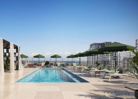 a swimming pool on the rooftop of a hotel with chairs and umbrellas
