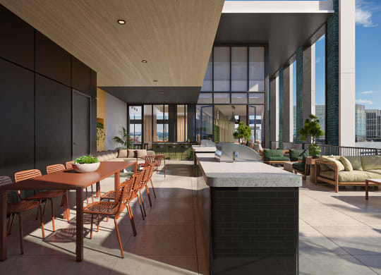 a communal area with a table and chairs and a kitchen