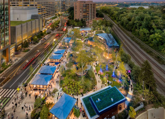 an aerial view of a city park with buildings and trees