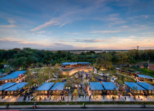 an aerial view of a park with buildings and trees