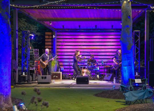 a band playing on a stage at a concert