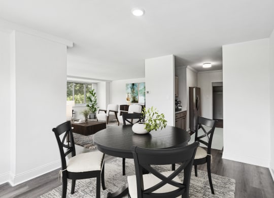a dining room with a table and chairs