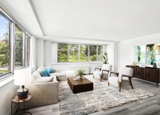 a living room with a couch and chairs and a table