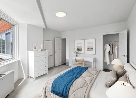 a bedroom with a bed and a dresser