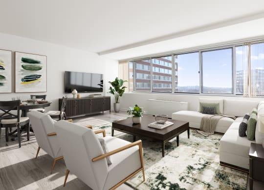 a living room with white furniture and a large window