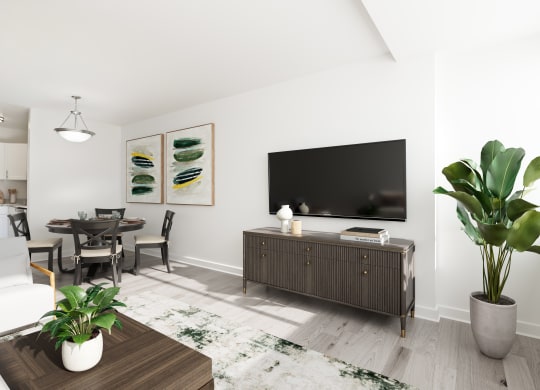 a living room with a large tv and a table and chairs