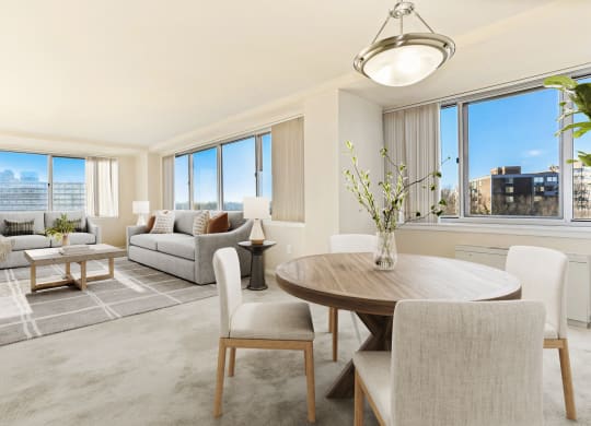 a living room with a dining room table and a couch