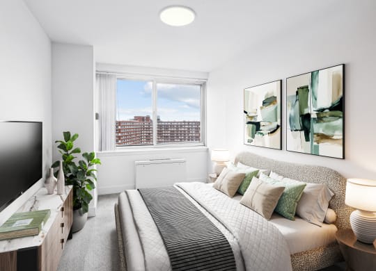 a bedroom with a large bed and a tv