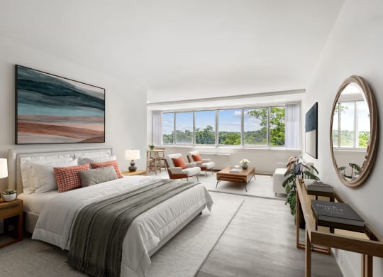 a bedroom with a bed and a large window