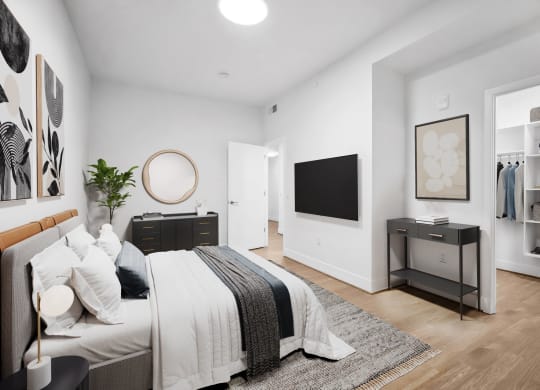 a bedroom with a bed and a tv at The Grace and Reva, Arlington