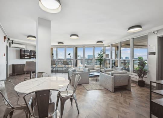 a living room with couches and chairs and a table