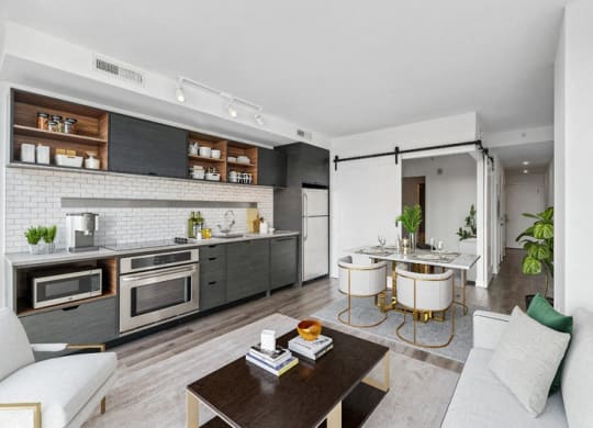 a living room with a kitchen and a dining room