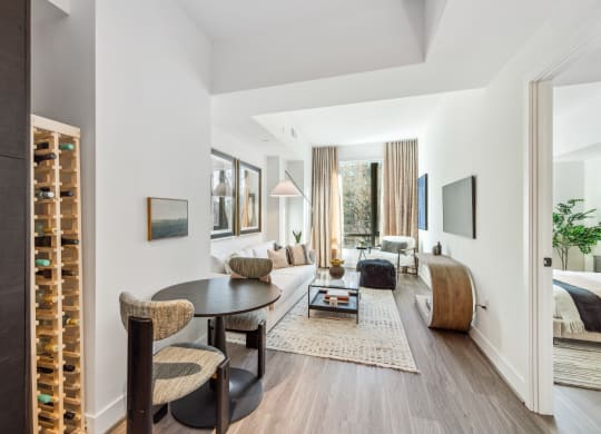 a living room with a couch and a table    and a bedroom at The Grace and Reva, Arlington, Virginia