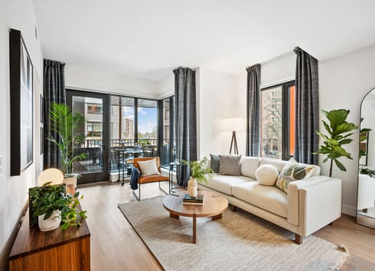 a living room with a couch and a coffee table at The Grace and Reva, Arlington, Virginia