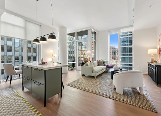 A modern living room with a large window and a view of the city.