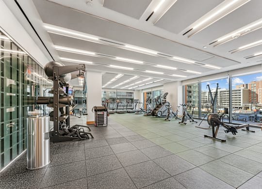 A gym with a variety of exercise equipment.