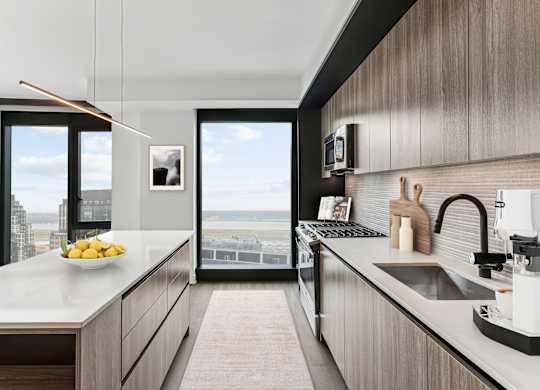 A modern kitchen with a view of the city.